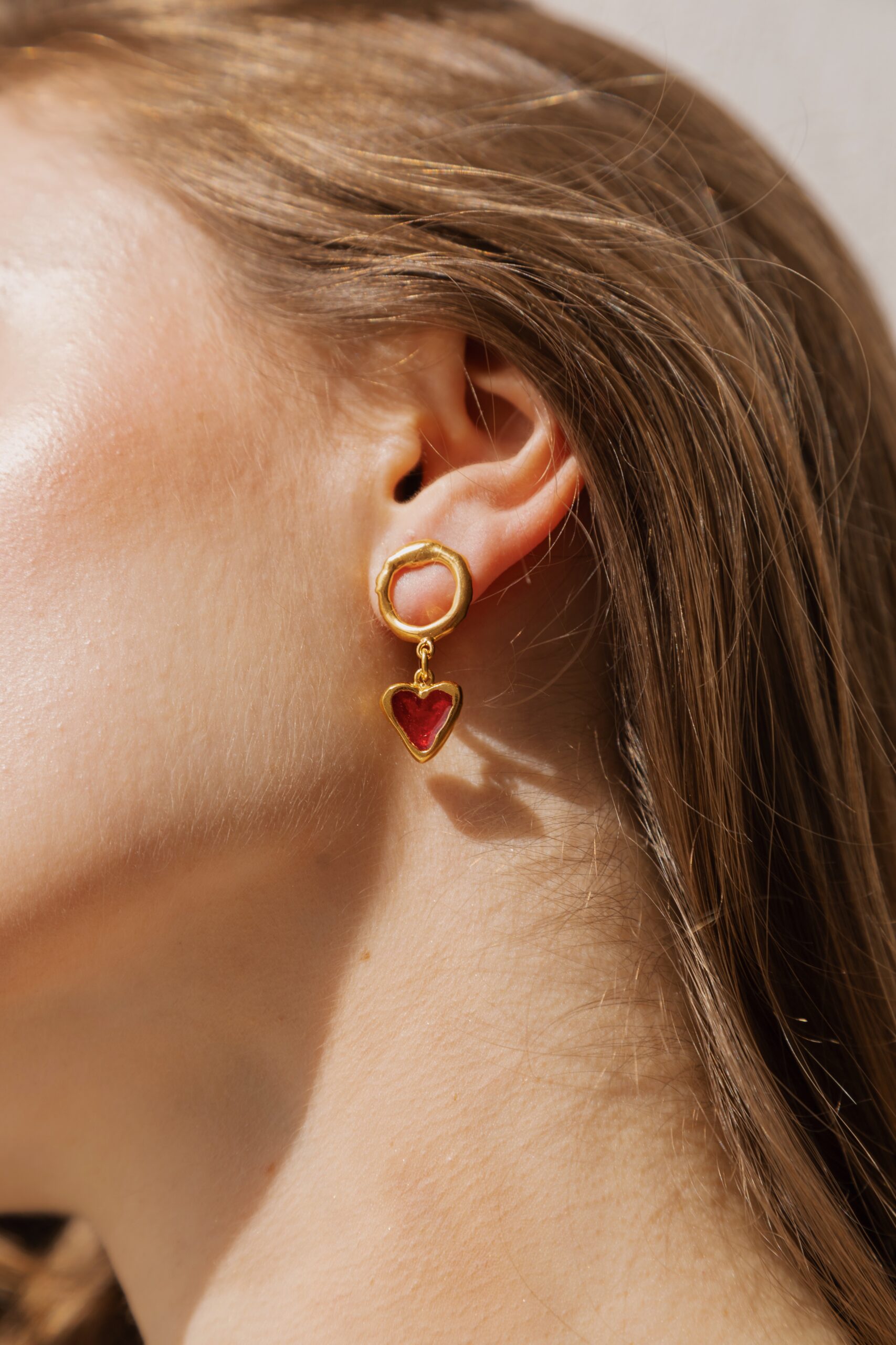 red hearts earrings. Gold plated